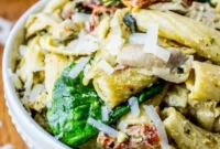 Vibrant Pesto Chicken Pasta with Sun-Dried Tomatoes and Artichokes