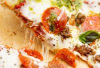 Fire-Kissed Pesto Pepperoni Sausage Pizza