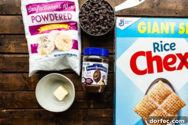 all the ingredient for dark chocolate muddy buddies sitting on a wooden table including a box of rice chex cereal, chocolate chips, butter, powdered sugar and dark chocolate peanut butter spread