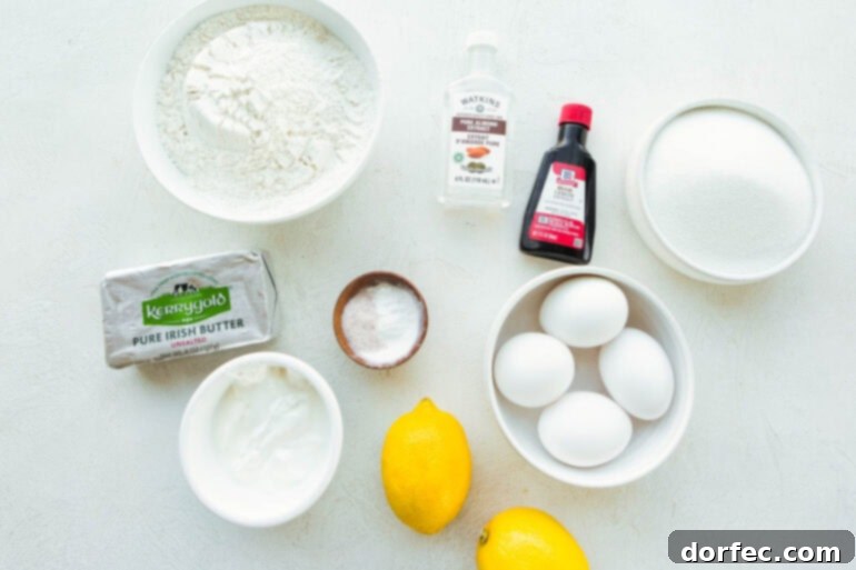 Zesty Lemon Glazed Loaf 4 A vibrant flat lay of all the fresh, high-quality ingredients needed to bake a lemon pound cake, including whole lemons, eggs, flour, sugar, and more.
