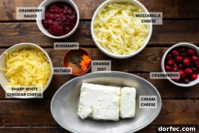 all the ingredients for baked cranberry cream cheese dip in separate small bowls