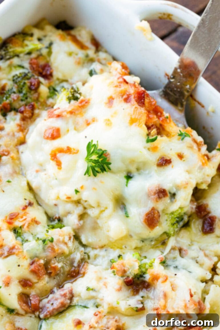 A photo of a serving of white vegetable lasagna being scooped out of a full pan, highlighting its creamy layers and golden crust.