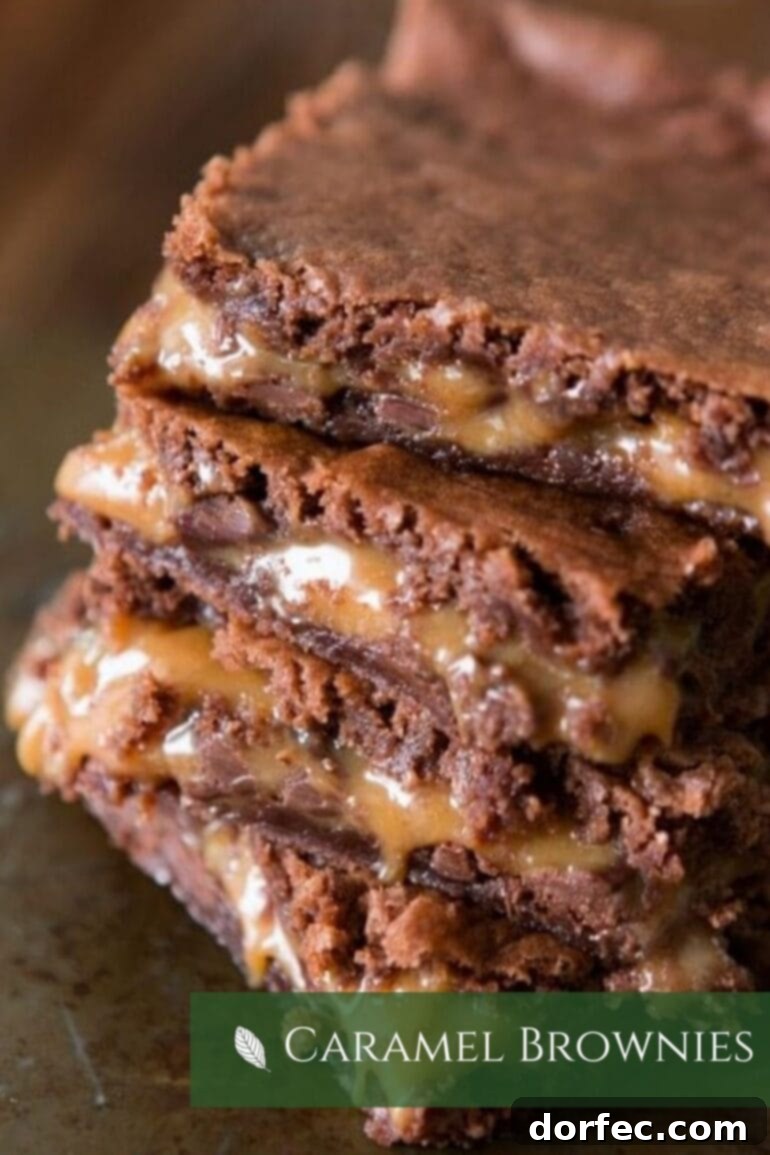 A tempting stack of fudgy caramel brownies, showcasing their rich, dense texture and gooey caramel swirls, a perfect Super Bowl dessert.
