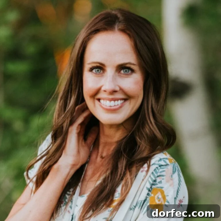 Carrian Cheney smiling, representing a helpful tip for using rotisserie chicken in recipes.
