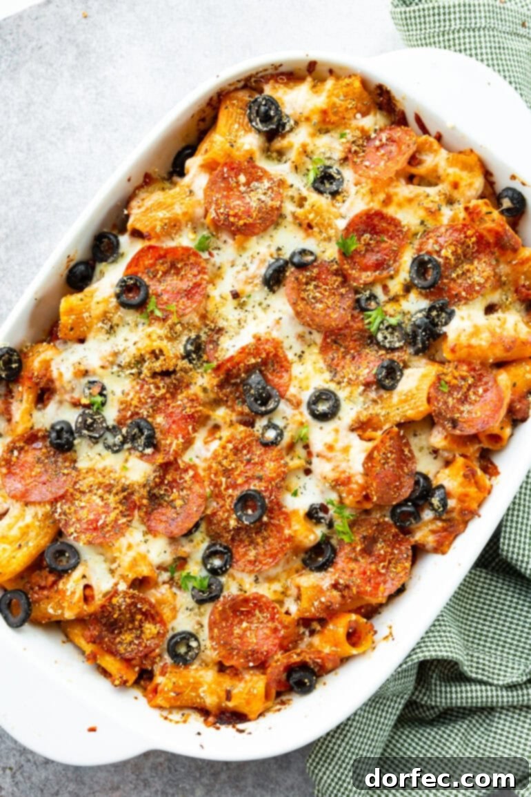 a photo of a casserole dish full of baked pizza pasta casserole