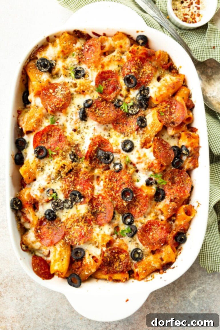 a photo of a baked pizza casserole in a white casserole dish