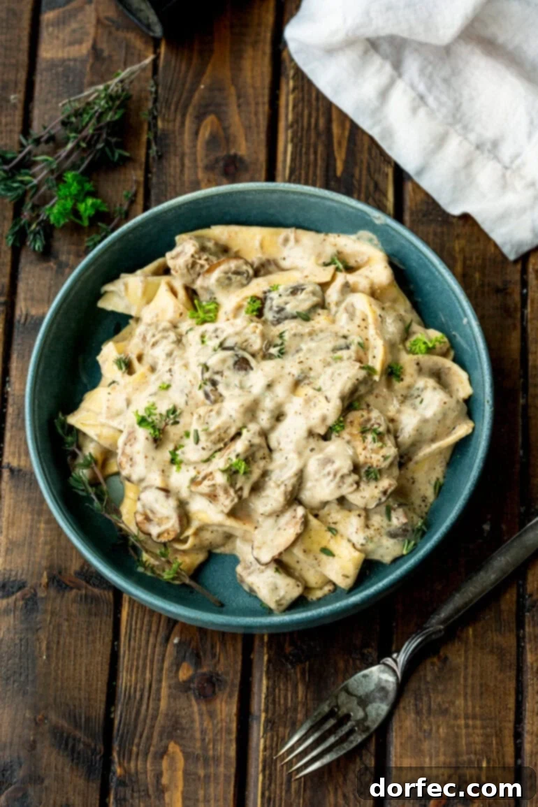 Bowl of creamy beef stroganoff with fresh herbs