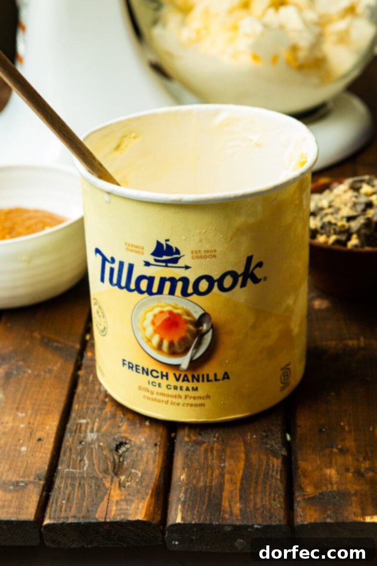 A tub of Tillamook French Vanilla ice cream, highlighted as the ideal base for the shortcut recipe, sitting on a counter.
