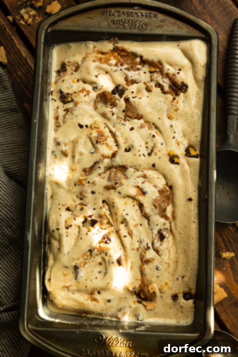 A bread loaf pan filled to the brim with creamy Graham Canyon ice cream, ready to be frozen and enjoyed, showcasing its rich texture.