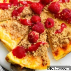 A close-up photo of a baked cheesecake yogurt slice with toppings.