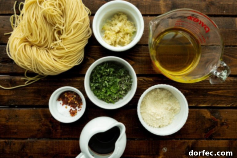 Individual bowls showcasing the fresh ingredients for spaghetti aglio e olio: olive oil, minced garlic, a mix of fresh herbs, red pepper flakes, salt, and balsamic vinegar.