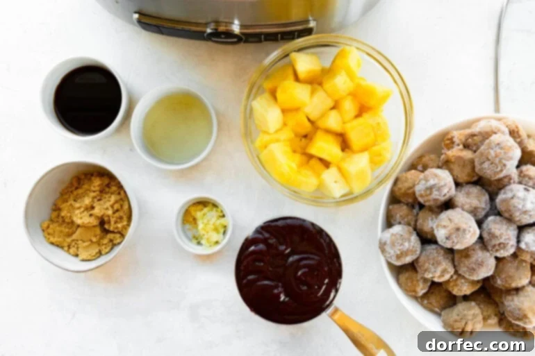 all the ingredients for slow cooker hawaiian meatballs in separate small bowls including bbq sauce, pineapple chunks, frozen meatballs, brown sugar and garlic 