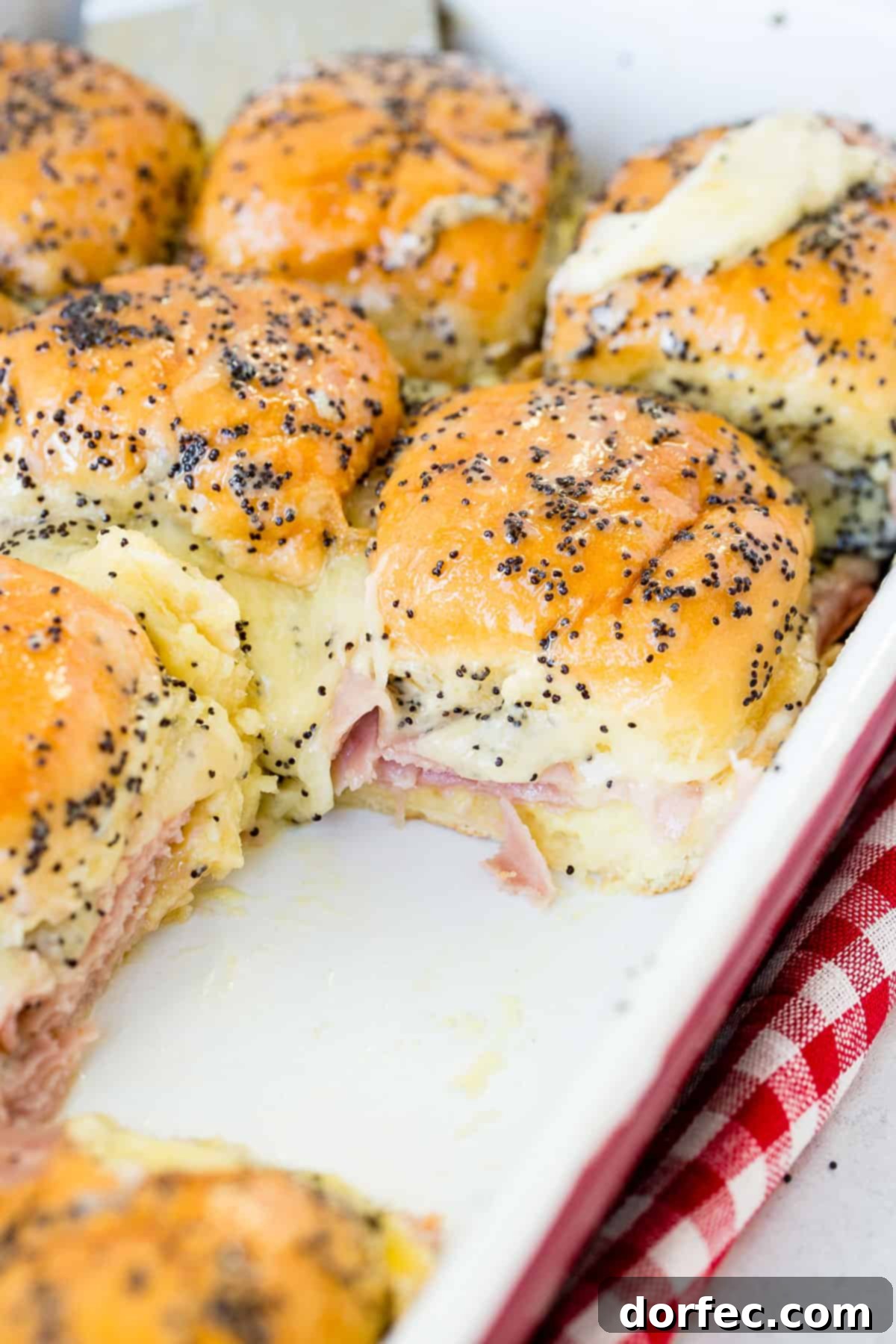 The best recipes for leftover ham include these incredible ham and cheese sliders with poppy seed dressing!