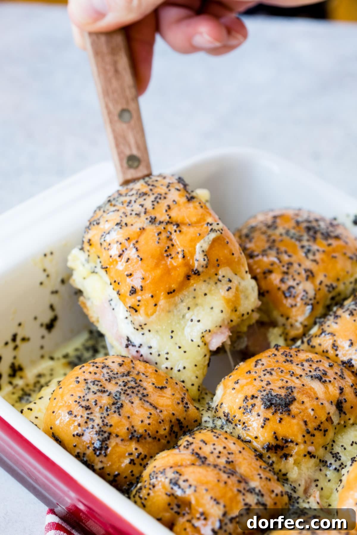 Looking for creative recipes for leftover ham? These ham and cheese sliders with poppy seed dressing are a top choice!