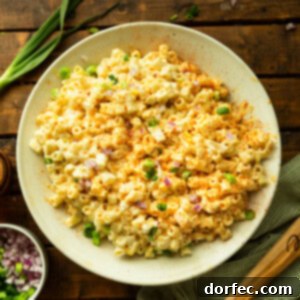 A photo of a bowl full of creamy deviled egg pasta salad, perfect for summer entertaining.