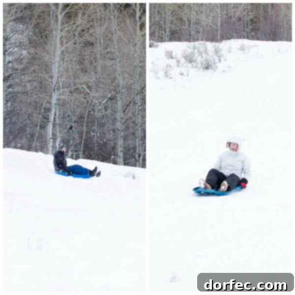 Cade's Thrilling Sledding Adventure at Teton Springs An adult, Cade, excitedly sledding down a snowy slope at Teton Springs, embodying the family's adventurous spirit.
