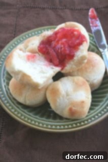 A small stack of freshly baked, warm one-hour rolls, demonstrating their quick preparation and appealing golden appearance, perfect for busy bakers.