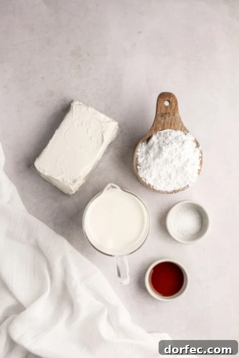 Fluffy Tangy Cream Cheese Frosting 3 A vibrant flat lay showcasing all the fresh ingredients needed for a perfect whipped cream cream cheese frosting, neatly arranged in separate small bowls.