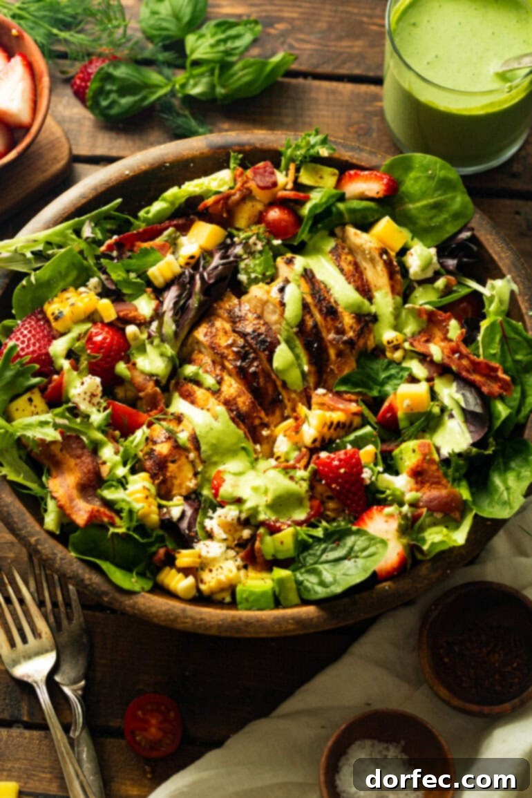 A close-up shot of perfectly sliced grilled chicken breasts nestled atop a bed of mixed greens, beautifully drizzled with the creamy basil dressing, highlighting the succulent texture of the chicken.