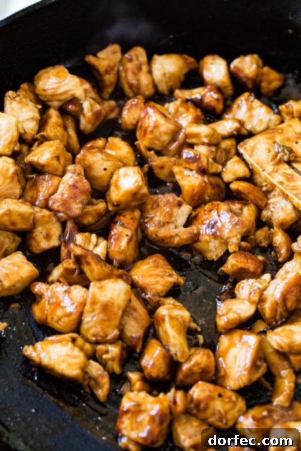 Teriyaki Chicken Quesadilla A photo of teriyaki chicken being cooked in a skillet.