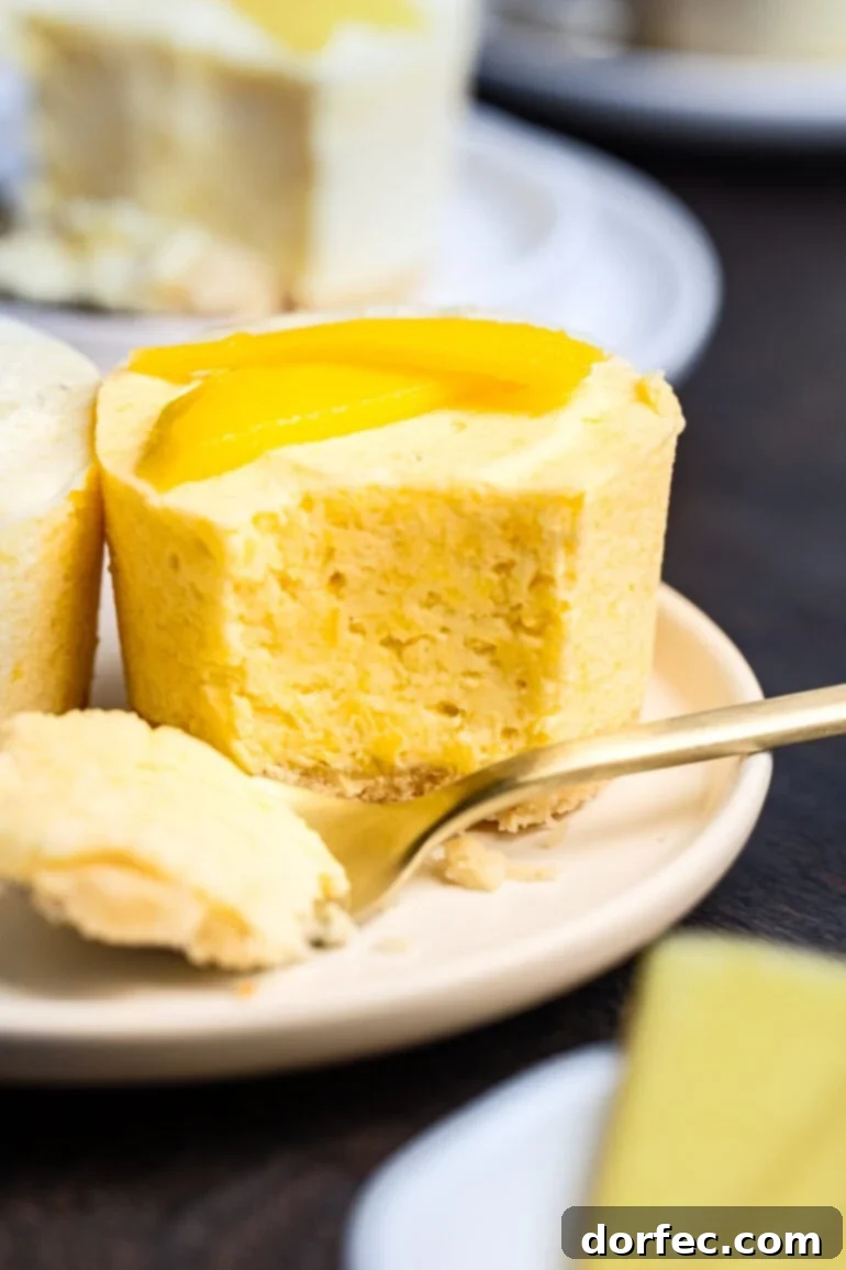 a small frozen mango pie with a fork removing a bite so you can see the cross section of the pie 