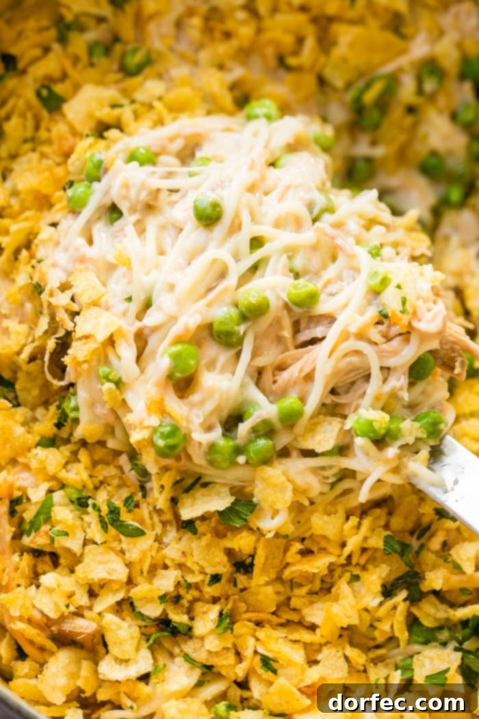 Creamy turkey tetrazzini with golden topping and peas