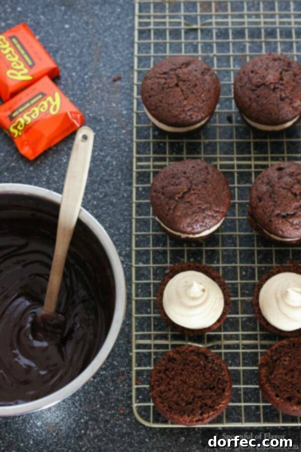 Chocolate Peanut Butter Cupcakes - are you drooling yet? Reese's peanut butter cups, chocolate ganache Rich Chocolate Peanut Butter Cupcakes topped with chocolate ganache and crumbled Reese's cups, a true delight for any dessert table.