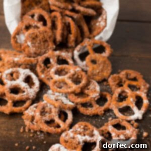 Finished Churro Pretzels piled high, shimmering with cinnamon sugar