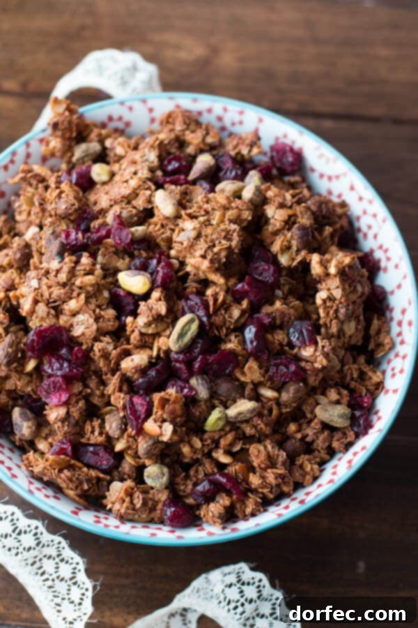 Homemade Pistachio Pomegranate Granola cooling on a baking sheet.