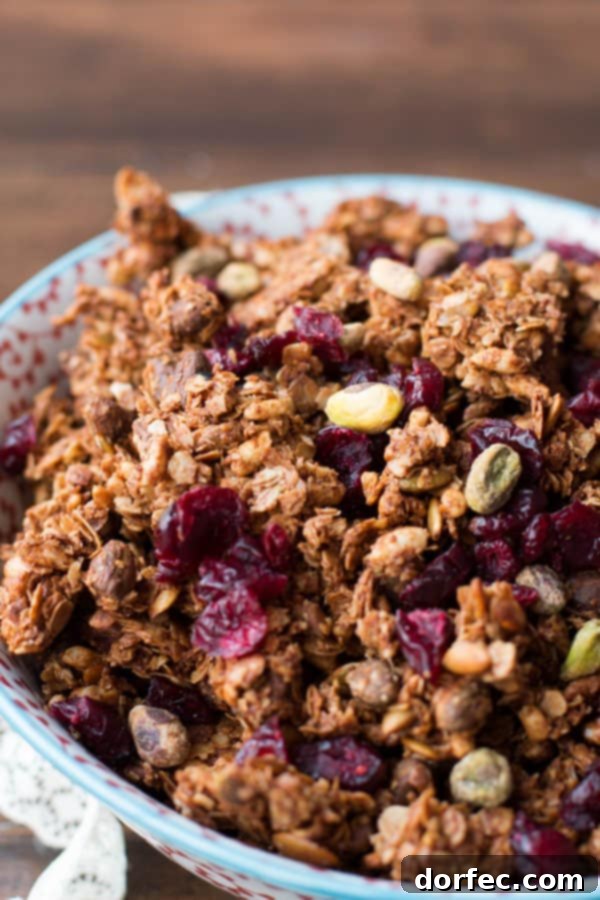 Close-up of crunchy Pistachio Pomegranate Granola clusters.