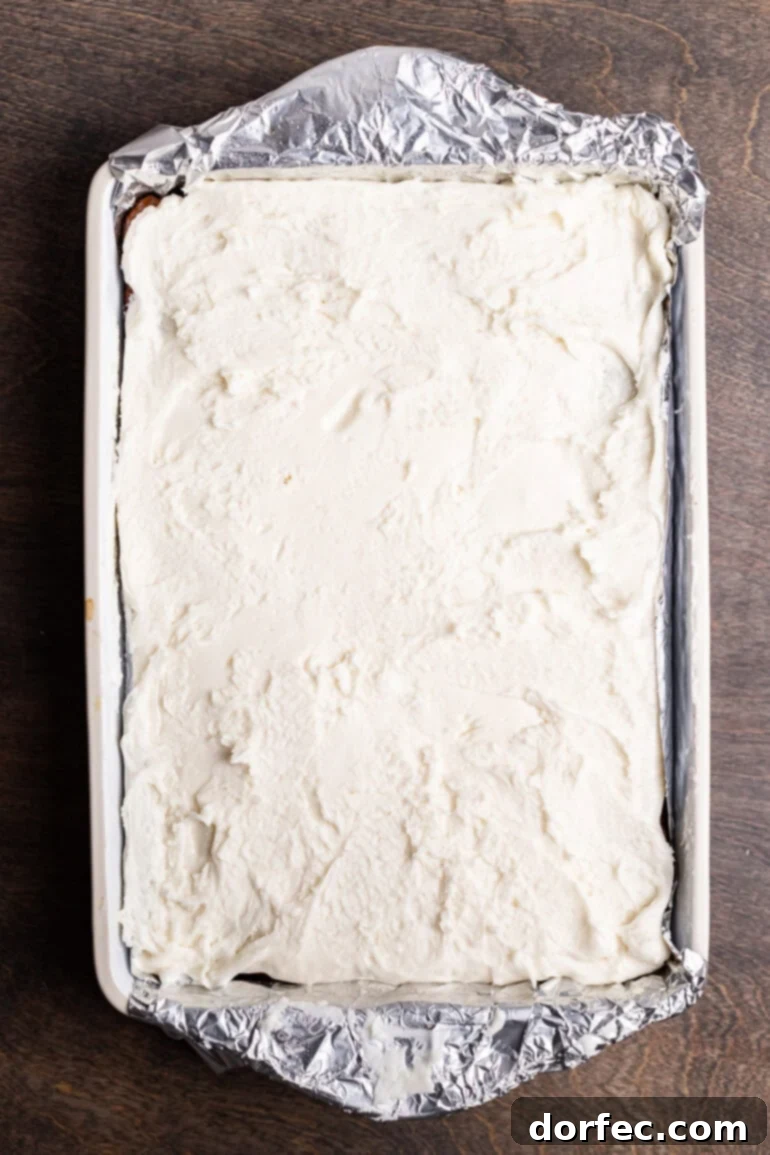 Rolling out the peppermint layer into a rectangle on plastic wrap.