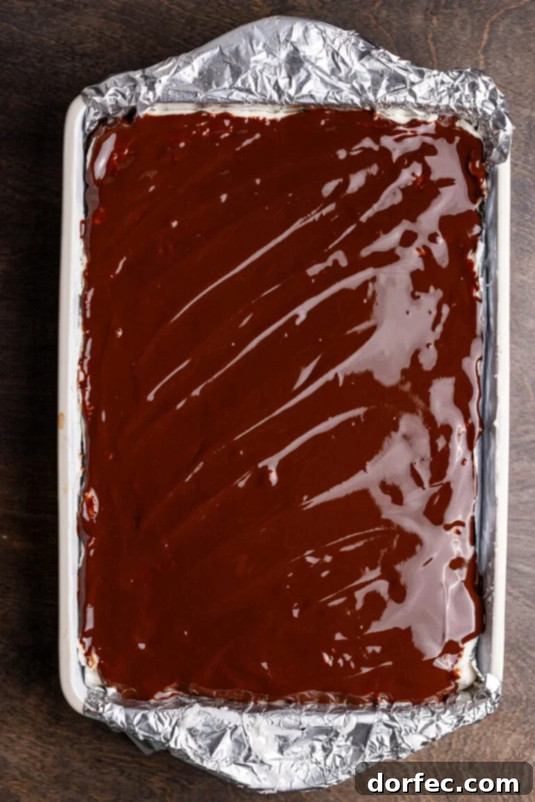Finished peppermint brownies in a pan, ready to be sliced.