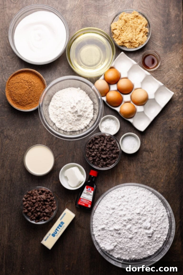 All the ingredients for peppermint brownies laid out in separate small bowls and containers, including flour, sugar, eggs, salt, baking soda, cocoa powder, chocolate chips, and oil.