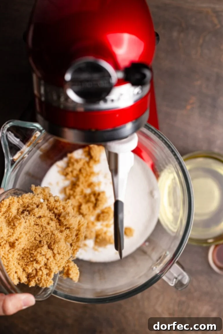 Mixing wet ingredients for brownies in a stand mixer.
