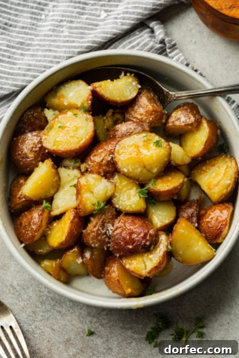Perfectly Roasted Red Potatoes 3 A simple white bowl showcasing tender, golden red potatoes, each piece perfectly seasoned and roasted to perfection, ready to be served.