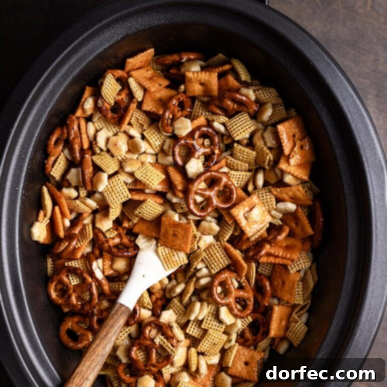 20+ Effortless Slow Cooker Dinners for Hectic Weeknights 3 Ranch Slow Cooker Chex Mix in a large bowl