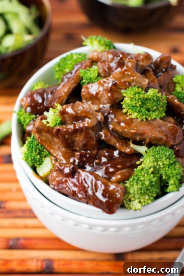 Best Homemade Beef and Broccoli Close-up of a sizzling beef and broccoli dish, ready to be served.