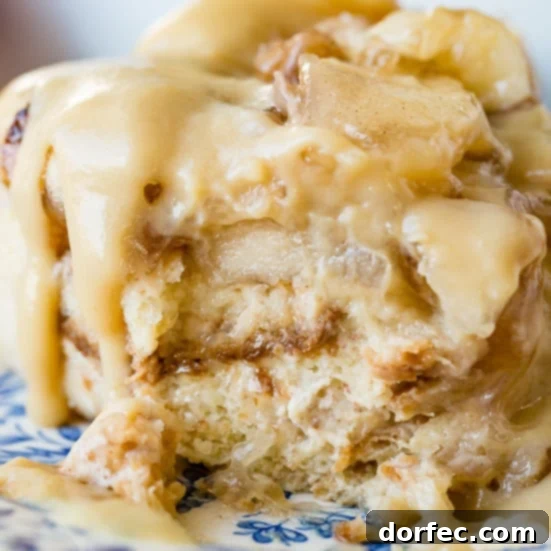 Custardy bread pudding loaded with tender cinnamon apples and drizzled with a luscious vanilla sauce, just like apple pie