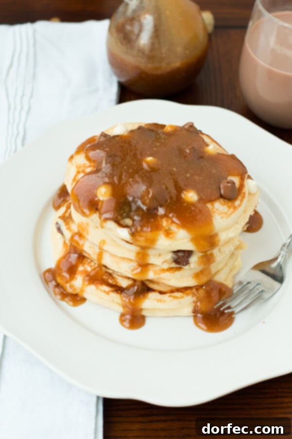 Breakfast Perfection: Peanut Butter Maple Syrup on Pancakes Close-up of fluffy pancakes topped with indulgent peanut butter maple syrup.