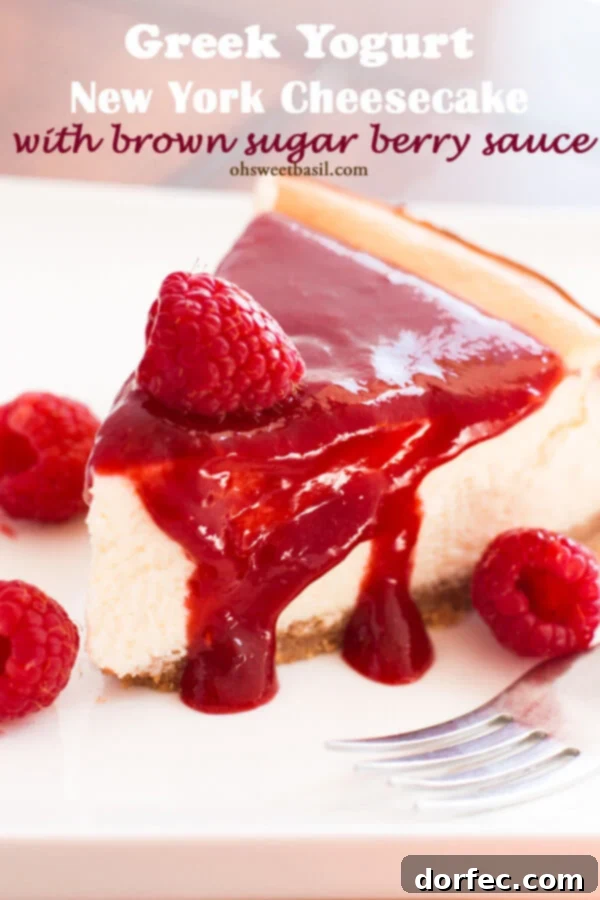 Indulge in a luscious Greek Yogurt New York Cheesecake topped with a vibrant brown sugar berry sauce.
