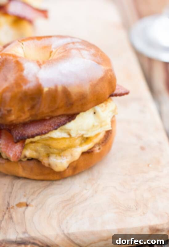 our favorite breakfast sandwich and the secret is in the bread ohsweetbasil.com bacon, cheddar, eggs, bagel, sausage, english muffin, to-go breakfast, quick breakfast