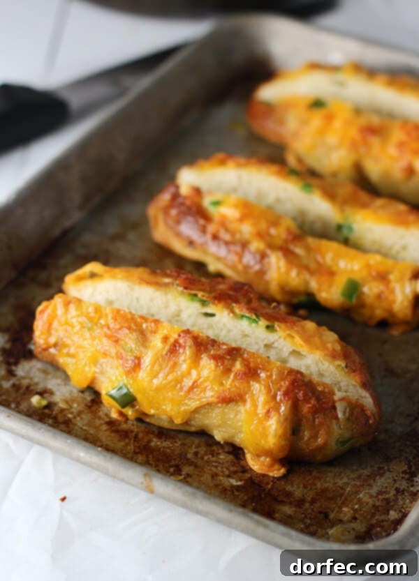 Jalapeño Cheddar Pretzel Buns: Perfect for Gourmet Hot Dogs Delicious Homemade Pretzel Buns Stuffed with Spicy Jalapeño and Melted Cheddar