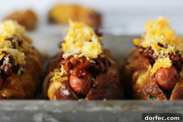 Gourmet Hot Dog with Jalapeño Cheddar Pretzel Bun and Turkey Chili Cheese Close-up of Jalapeño & Cheddar Pretzel Hot Dog Buns with Melted Turkey Chili Cheese