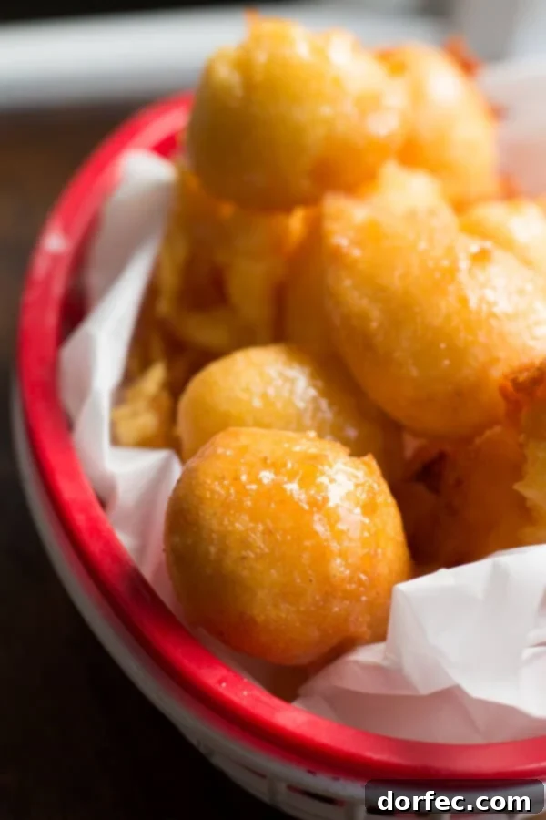 Crispy Fried Corn Fritters with Honey Butter Golden brown crispy corn fritters drizzled with sweet honey butter
