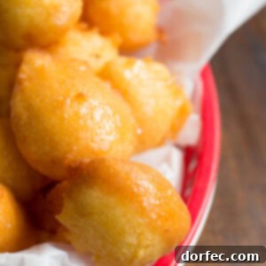 Golden Honey Butter Corn Fritters 2 honey butter drenched corn fritters that are fried to a crisp perfection ohsweetbasil.com