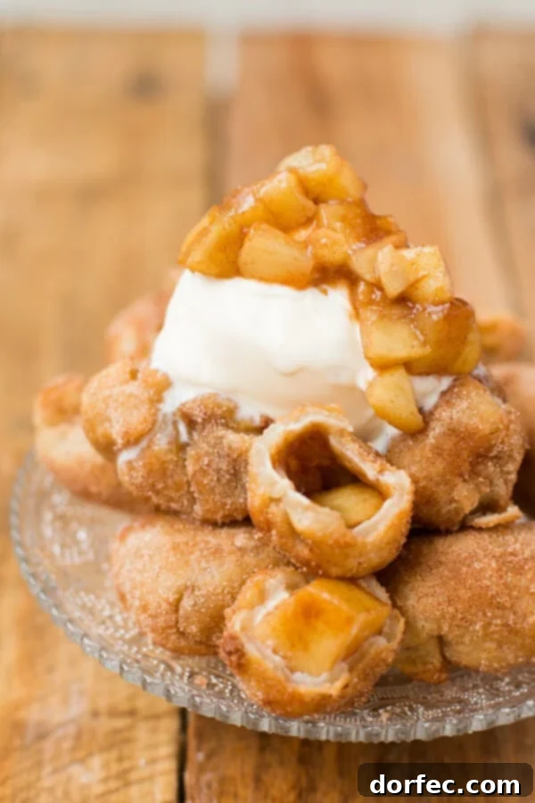 Fried apple pie bombs served a la mode with creamy vanilla ice cream. A delicious fall dessert recipe.