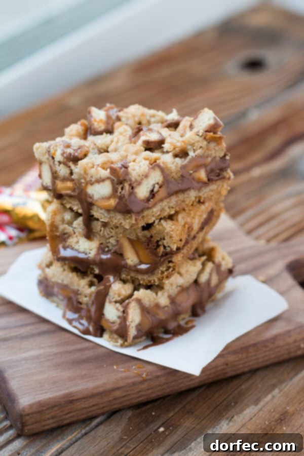 Twix Carmelitas: A delightful fusion of classic flavors Close-up shot of homemade Twix Carmelitas bars with caramel ribbons and chocolate