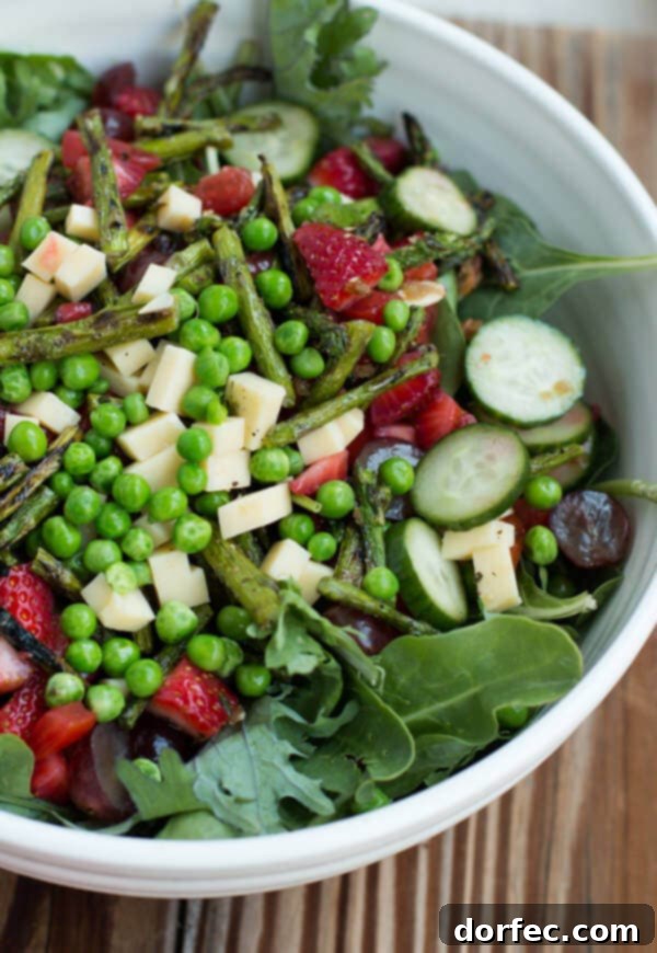 Pomegranate Raspberry Dressing Salad with Fresh Greens and Colorful Toppings