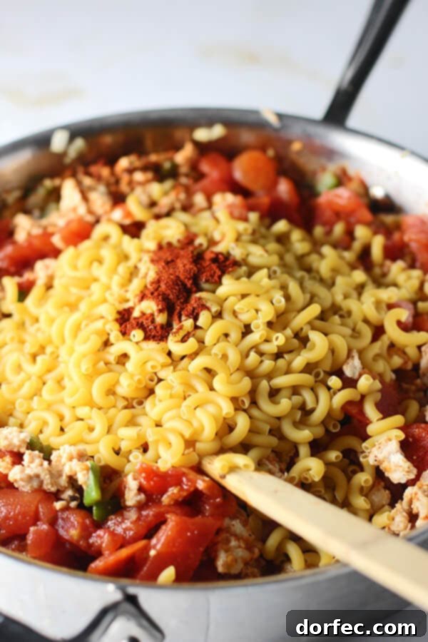 Fresh Ingredients for Healthy One-Pot Chili Mac Various chili mac ingredients artfully piled into a metal skillet