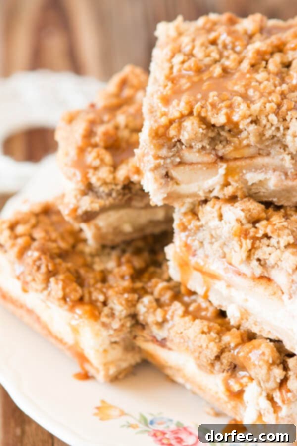 Delicious Cheesecake Caramel Apple Crisp Bars with a Secret Walnut Oat Topping - Perfect Fall Dessert